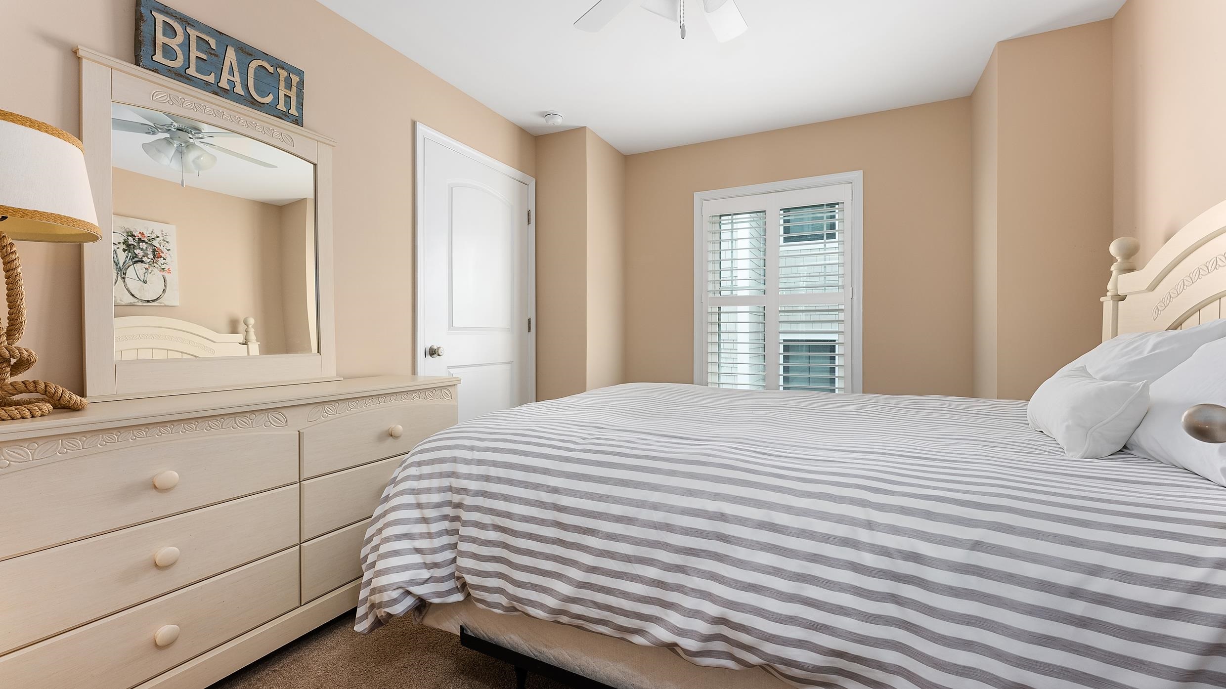 4477 Venicean Road, Unit SOUTH Sea Isle City, NJ 08243 - Photo 26 of 36 a bedroom with a bed and a window