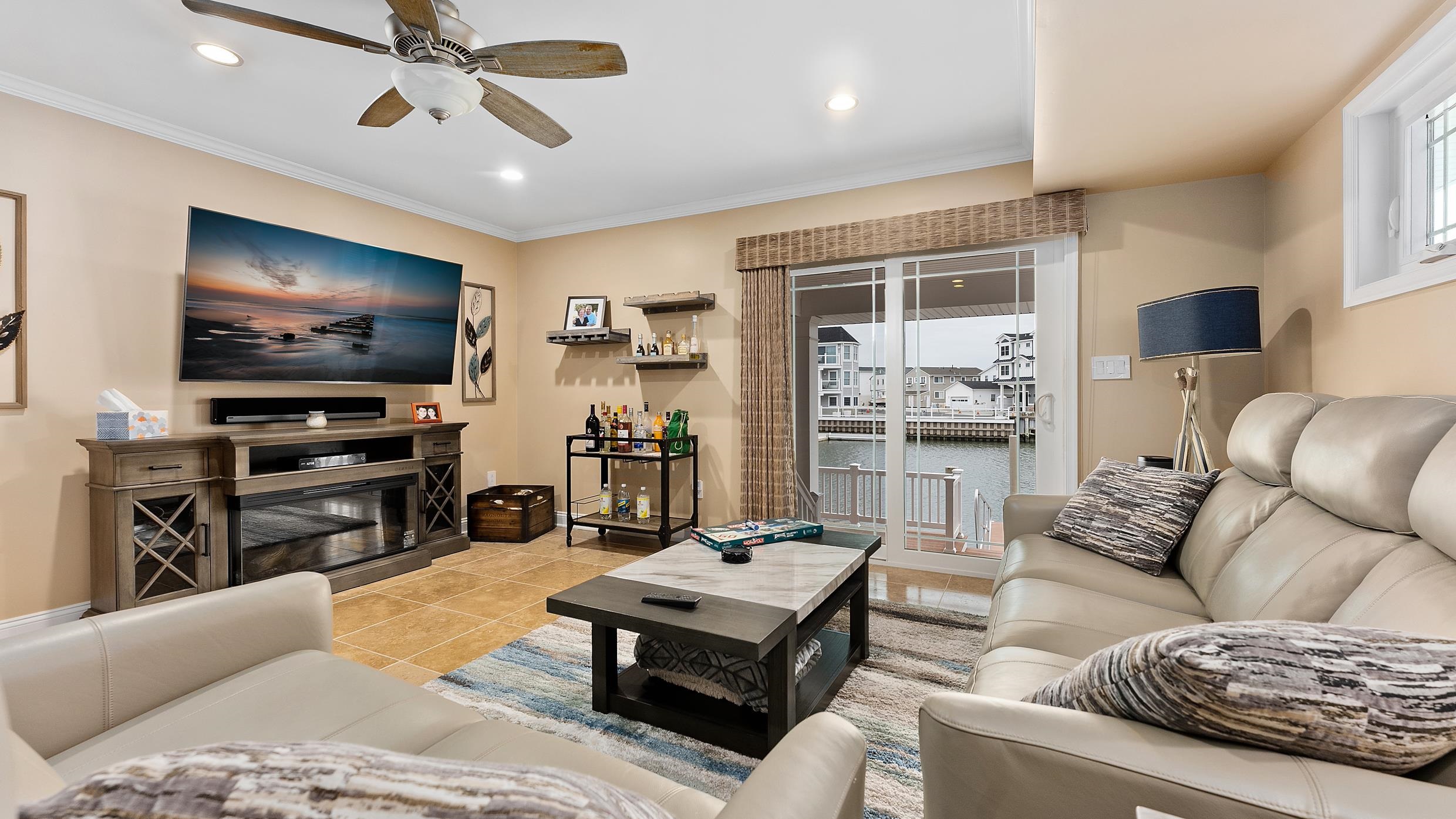 4477 Venicean Road, Unit SOUTH Sea Isle City, NJ 08243 - Photo 28 of 36 a living room with furniture and a flat screen tv