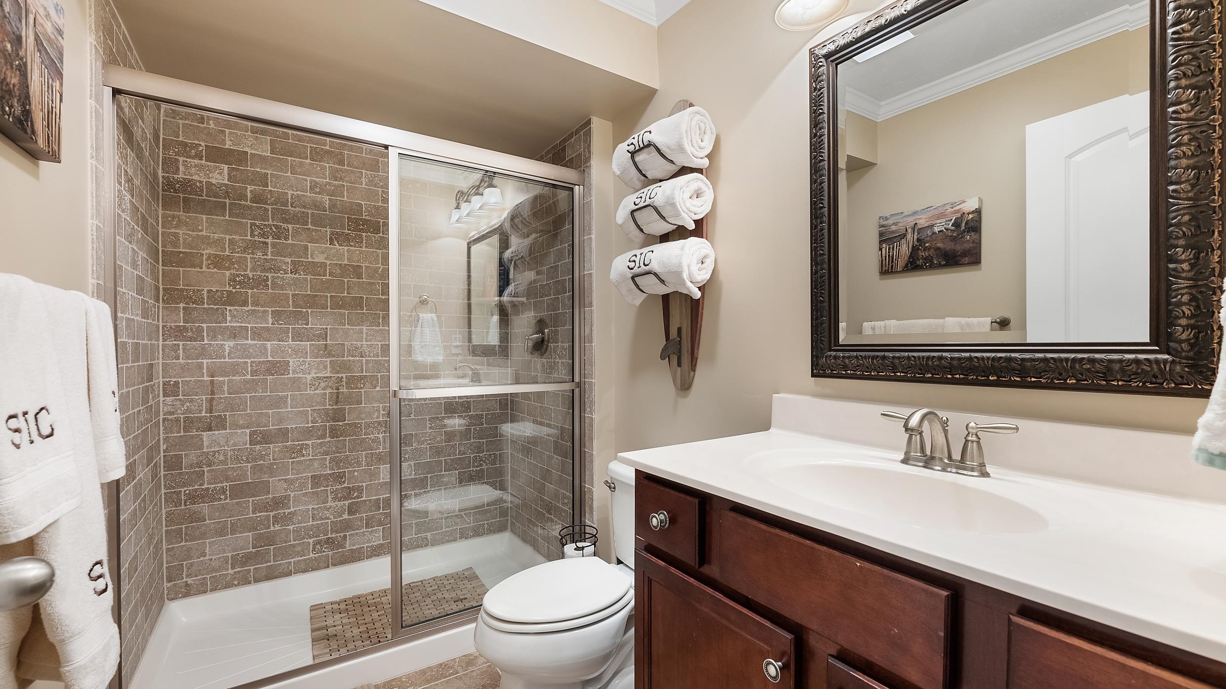 4477 Venicean Road, Unit SOUTH Sea Isle City, NJ 08243 - Photo 31 of 36 a bathroom with a sink vanity mirror and toilet