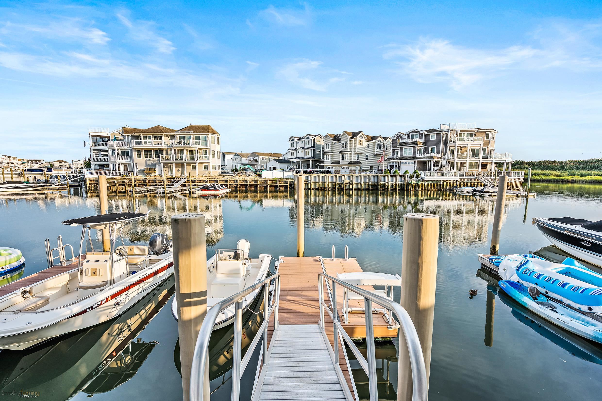 4477 Venicean Road, Unit SOUTH Sea Isle City, NJ 08243 - Photo 36 of 36 a view of a lake with tall buildings