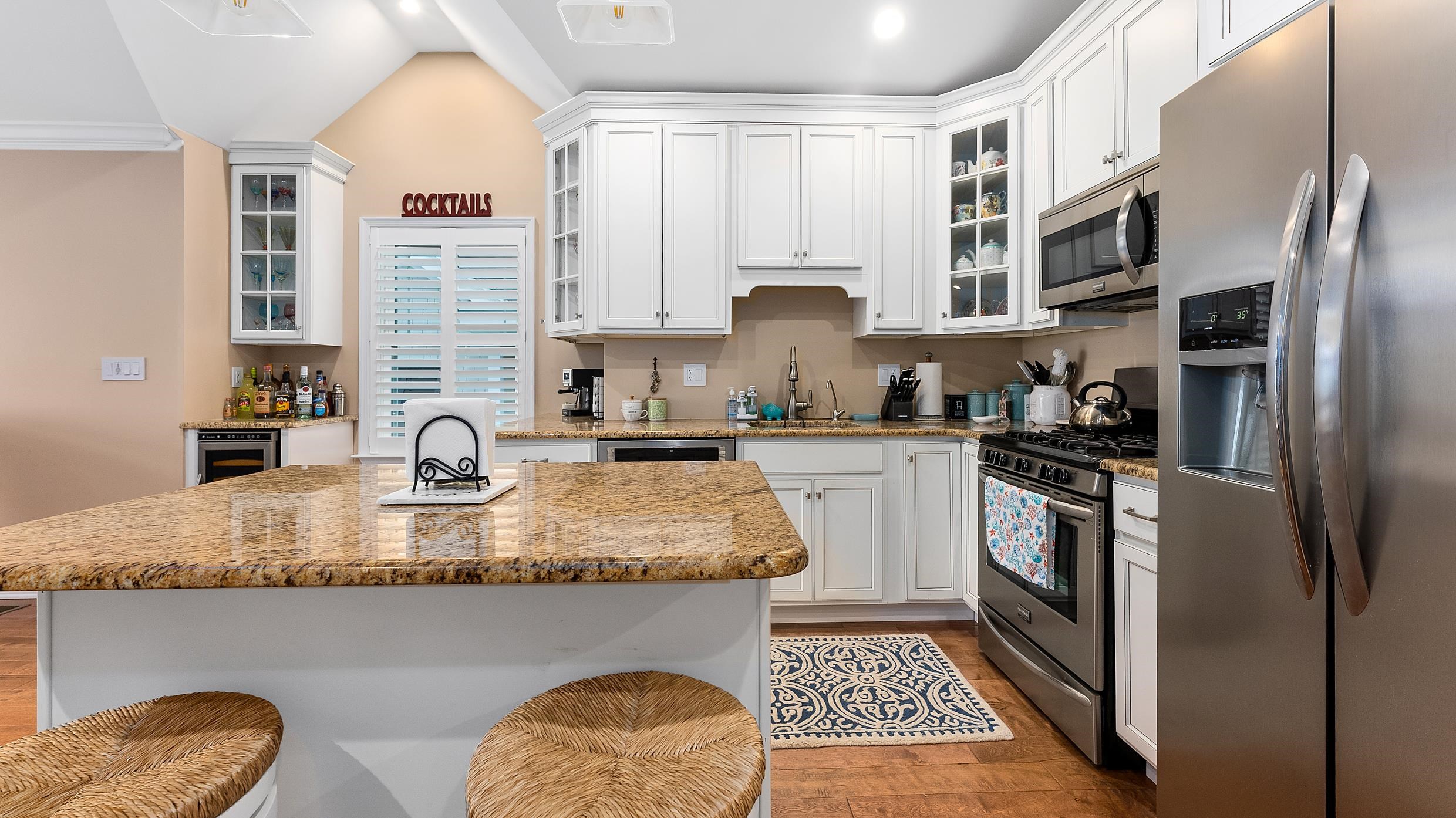 4477 Venicean Road, Unit SOUTH Sea Isle City, NJ 08243 - Photo 5 of 36 a kitchen with stainless steel appliances granite countertop a sink stove and refrigerator