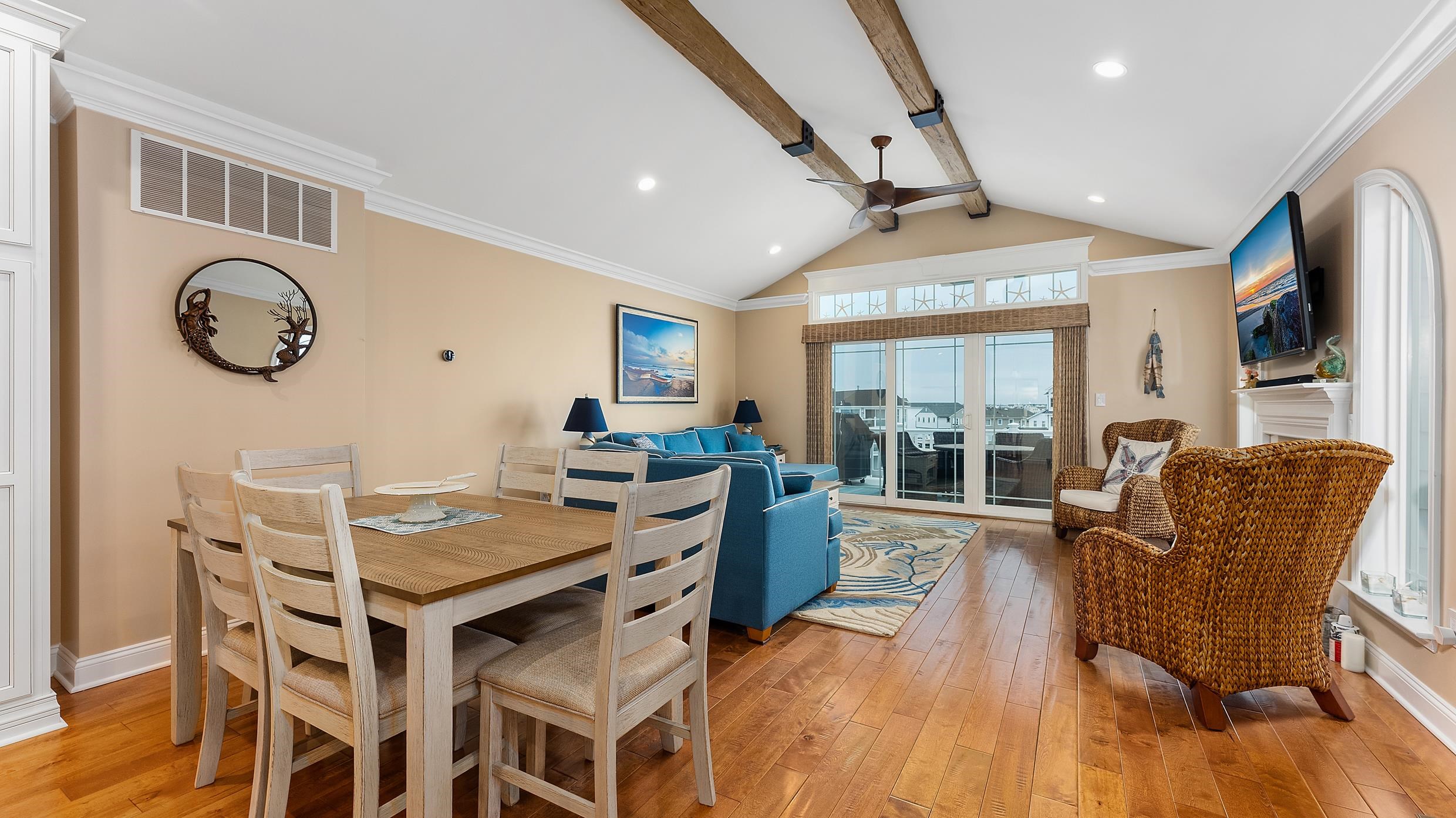 4477 Venicean Road, Unit SOUTH Sea Isle City, NJ 08243 - Photo 7 of 36 a view of a dining room with furniture window and wooden floor