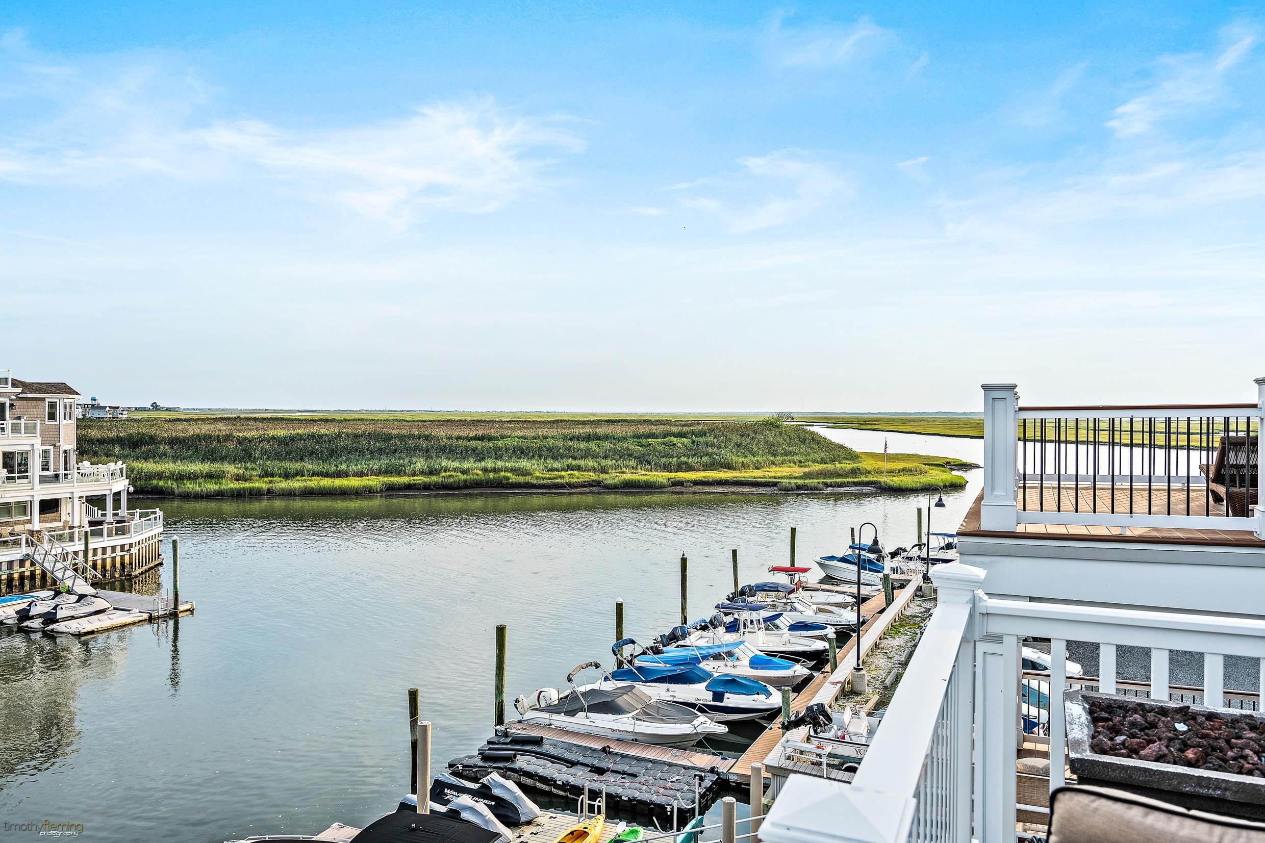4477 Venicean Road, Unit SOUTH Sea Isle City, NJ 08243 - Photo 10 of 36 a view of a city skyline and a lake
