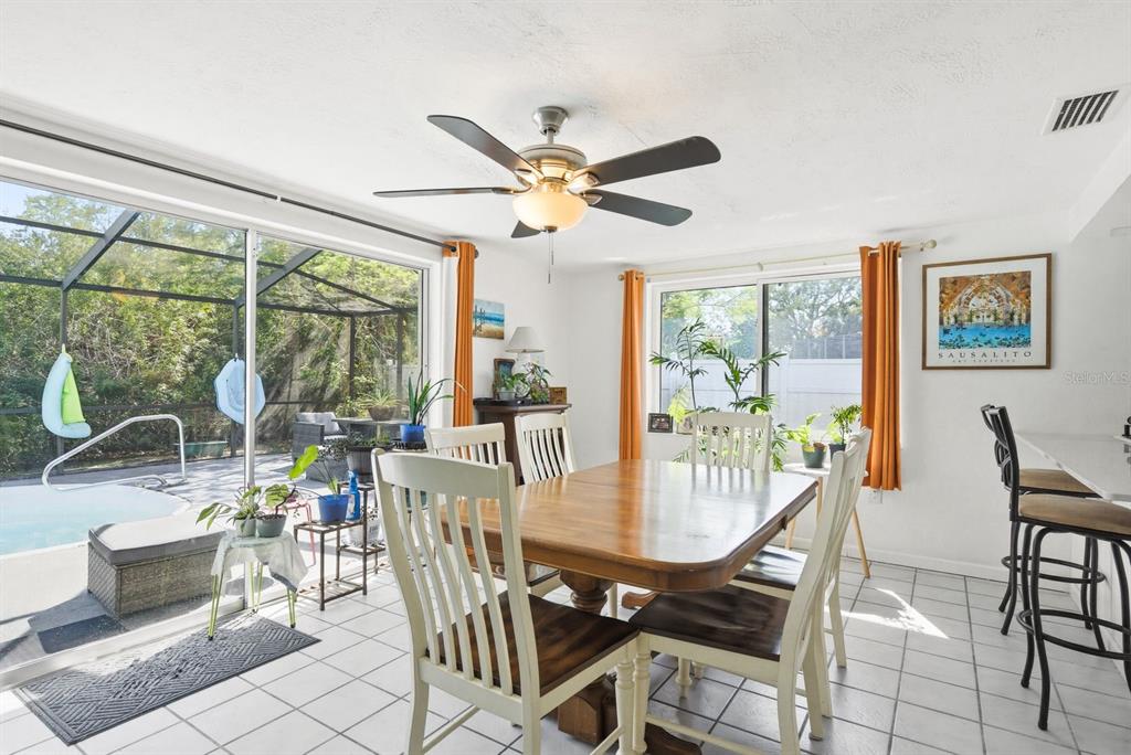 4276 Rudder Way New Port Richey, FL 34652 - Photo 9 of 29 a view of a dining room with furniture window and outside view