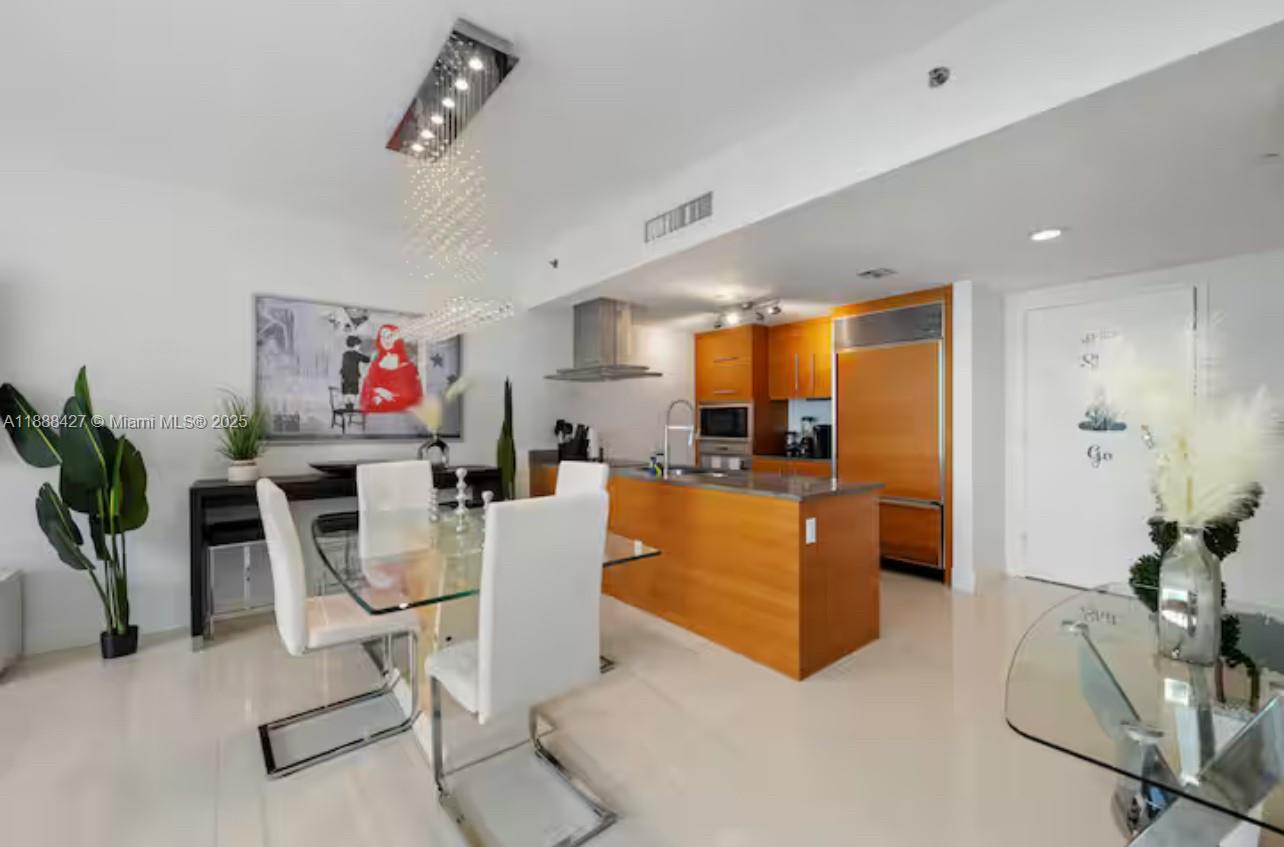 485 Brickell Avenue, Unit 3707 Miami, FL 33131 - Photo 14 of 41 a living room with furniture and a flat screen tv