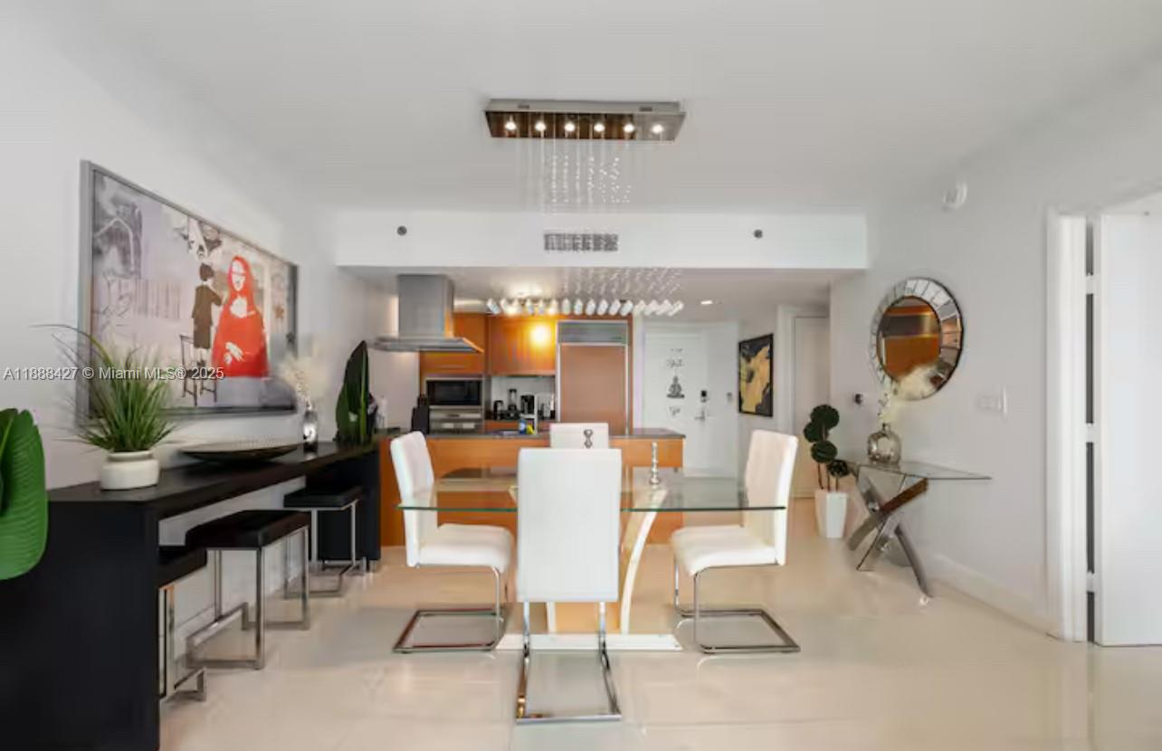 485 Brickell Avenue, Unit 3707 Miami, FL 33131 - Photo 16 of 41 a view of a livingroom with furniture and a flat screen tv