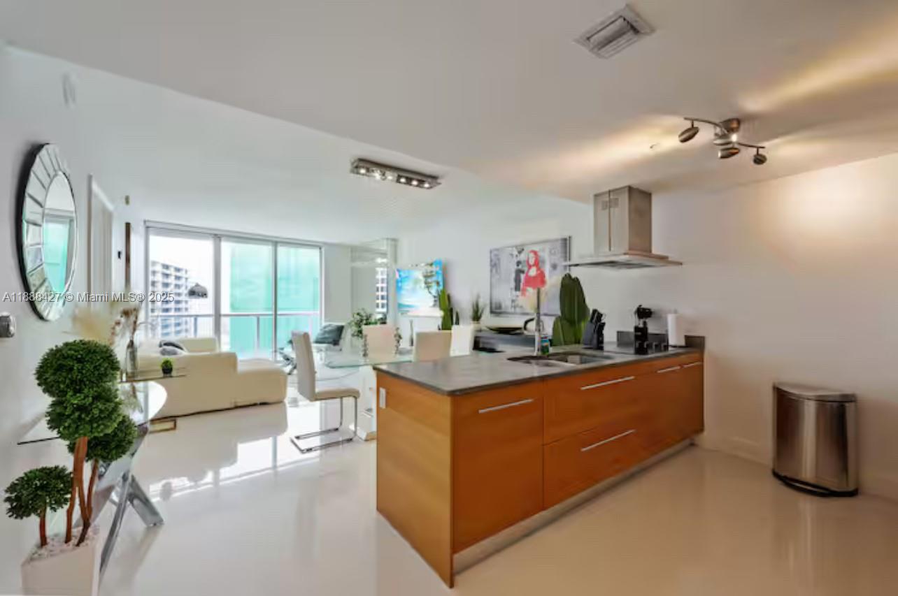 485 Brickell Avenue, Unit 3707 Miami, FL 33131 - Photo 21 of 41 a view of a living room and kitchen with furniture