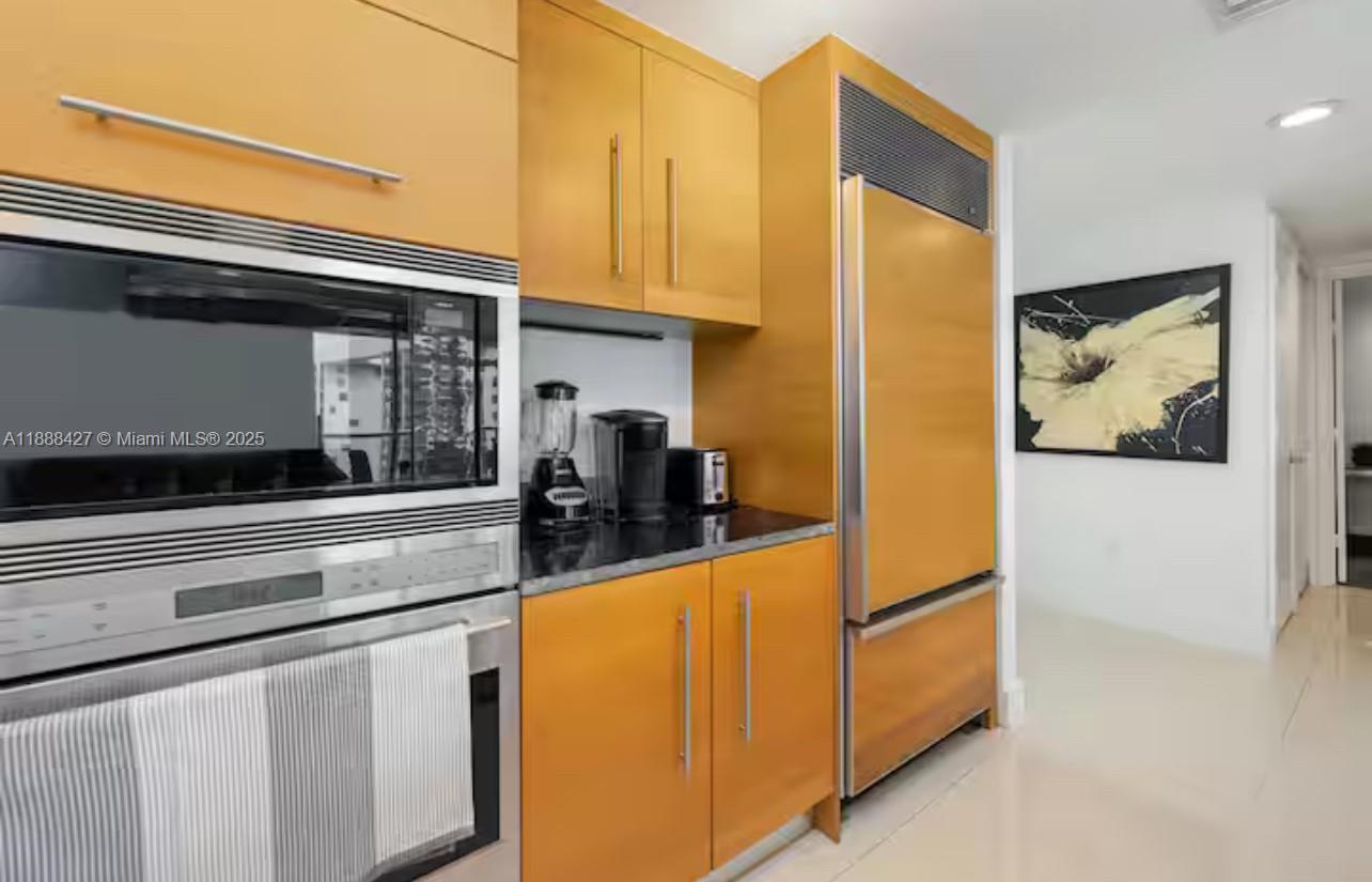 485 Brickell Avenue, Unit 3707 Miami, FL 33131 - Photo 23 of 41 a kitchen with stainless steel appliances a refrigerator and cabinets