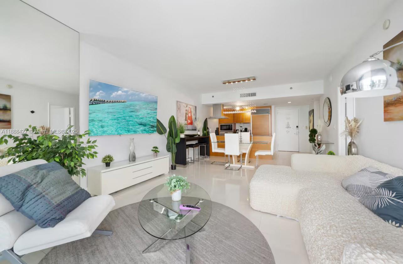 485 Brickell Avenue, Unit 3707 Miami, FL 33131 - Photo 25 of 41 a living room with furniture kitchen and a large window