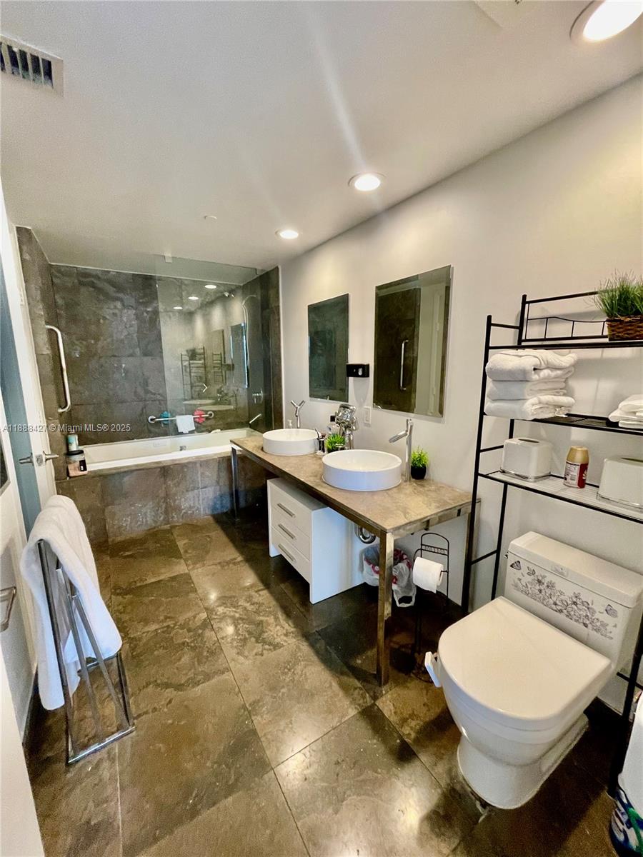 485 Brickell Avenue, Unit 3707 Miami, FL 33131 - Photo 35 of 41 a room with two chairs and a table