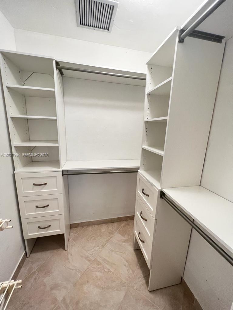 3324 Lakeview Boulevard Delray Beach, FL 33445 - Photo 27 of 36 a view of an empty walk in closet