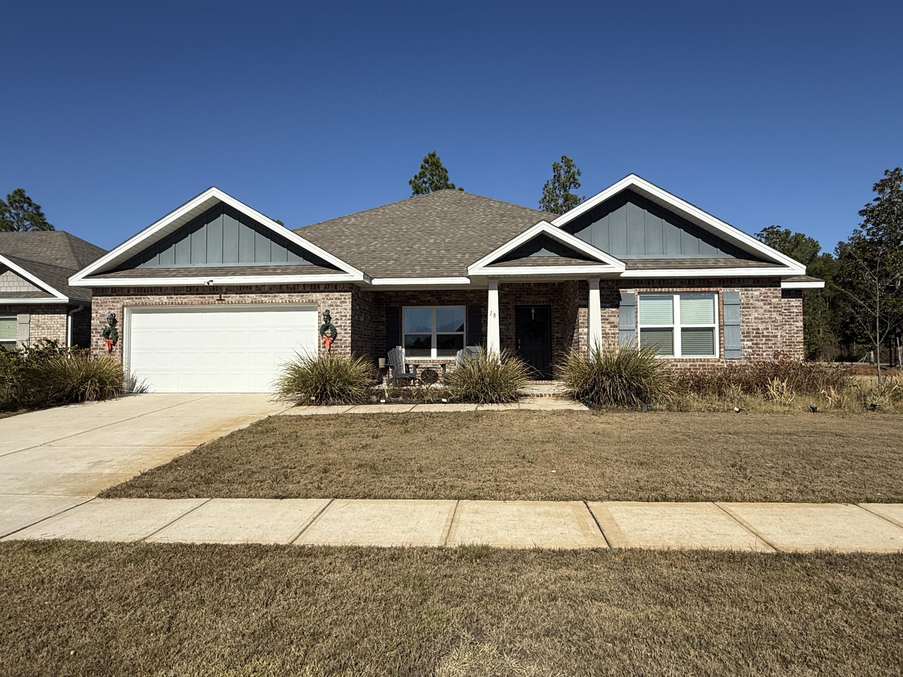 18 West Sky Way Freeport, FL 32439 - Photo 1 of 25 a front view of a house with yard