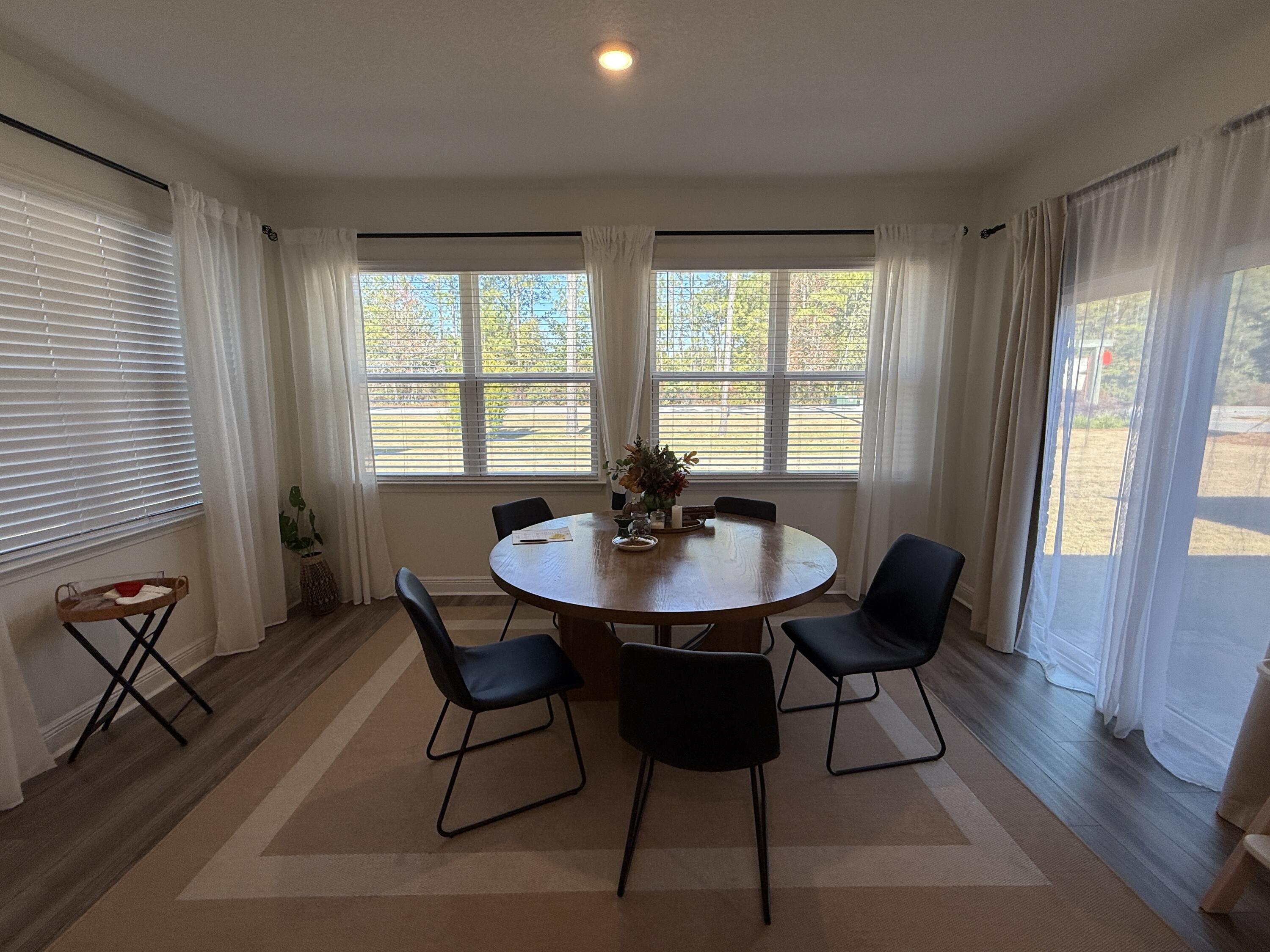 18 West Sky Way Freeport, FL 32439 - Photo 11 of 25 a view of a dining room with furniture and window