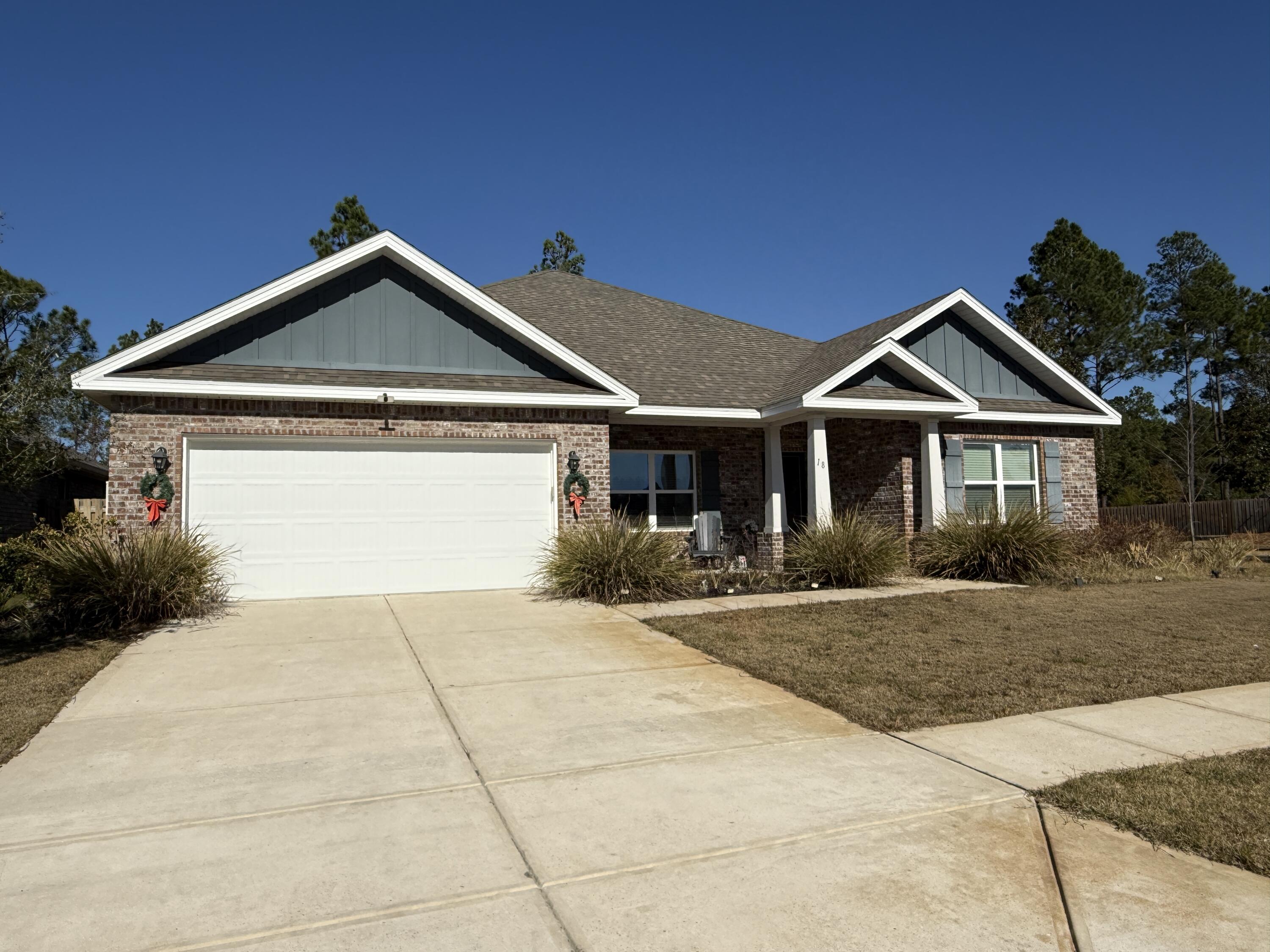 18 West Sky Way Freeport, FL 32439 - Photo 2 of 25 a front view of a house with yard