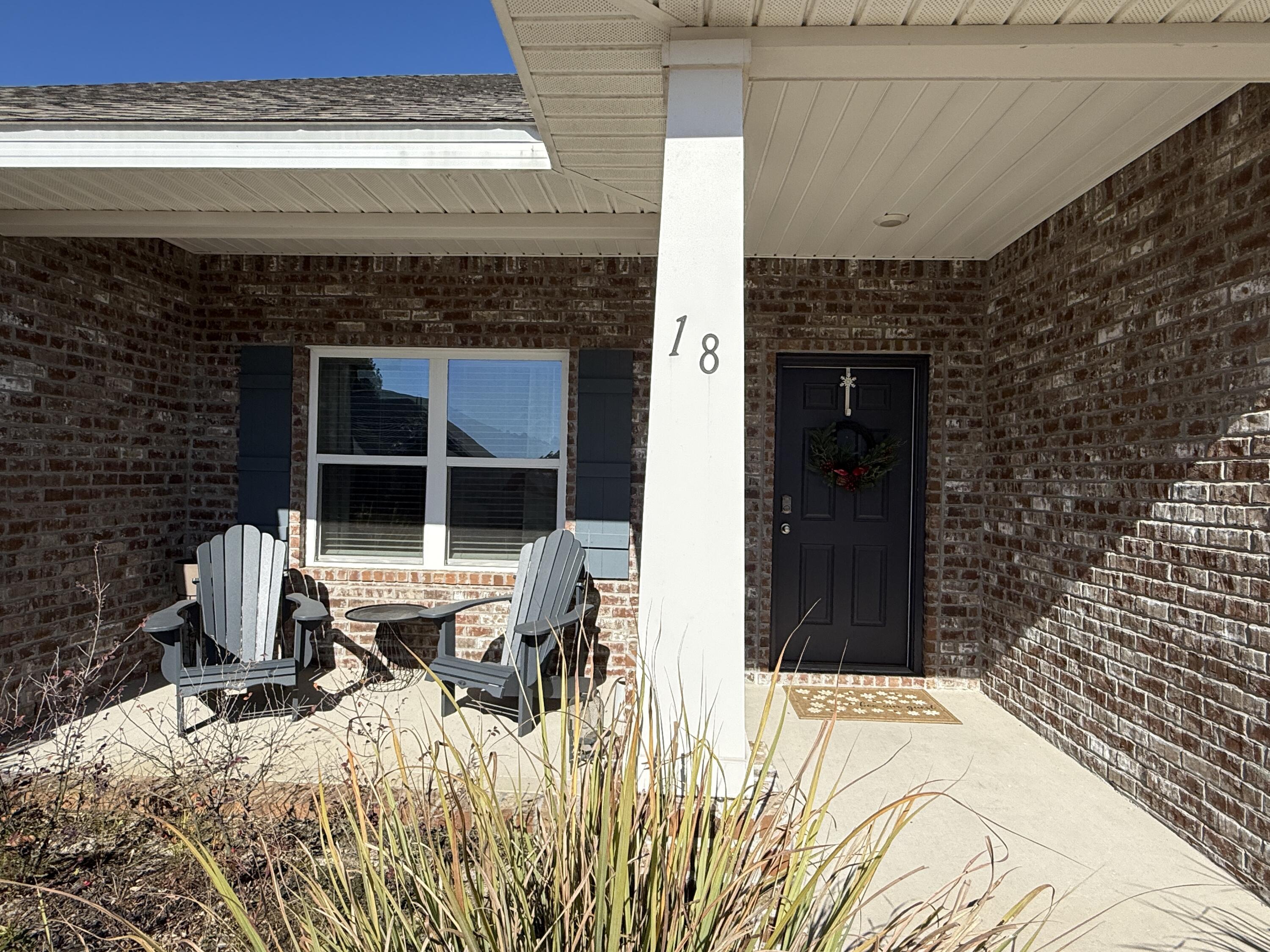 18 West Sky Way Freeport, FL 32439 - Photo 4 of 25 a bed sitting in a bedroom and chair