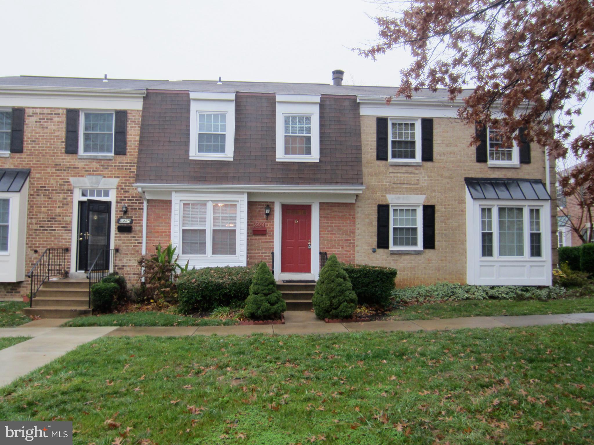 6486 Franconia Road Springfield, VA 22150 - Photo 2 of 16 a front view of a house with porch and garden