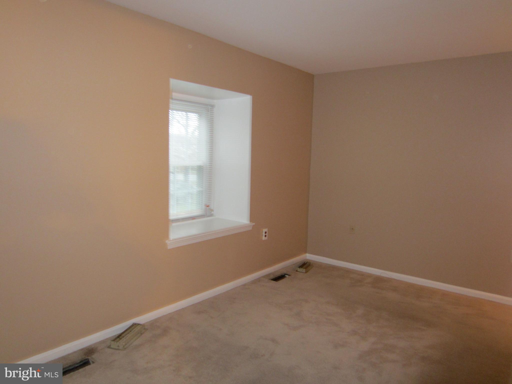 6486 Franconia Road Springfield, VA 22150 - Photo 8 of 16 an empty room with a window