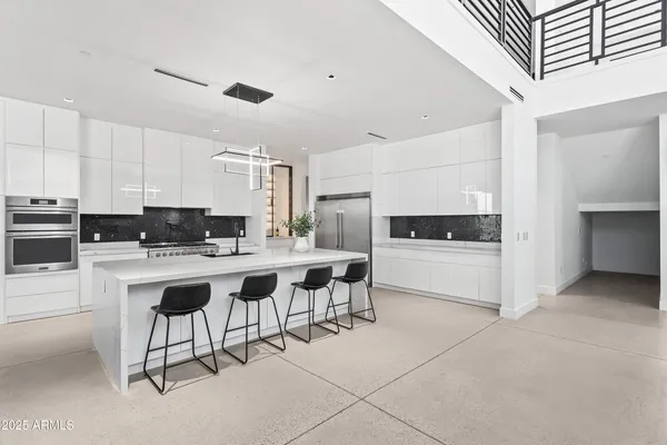 a view of a kitchen with furniture and windows