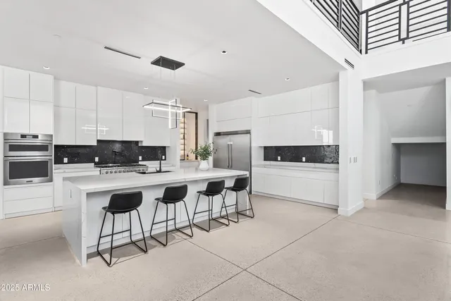 a view of a kitchen with furniture and windows