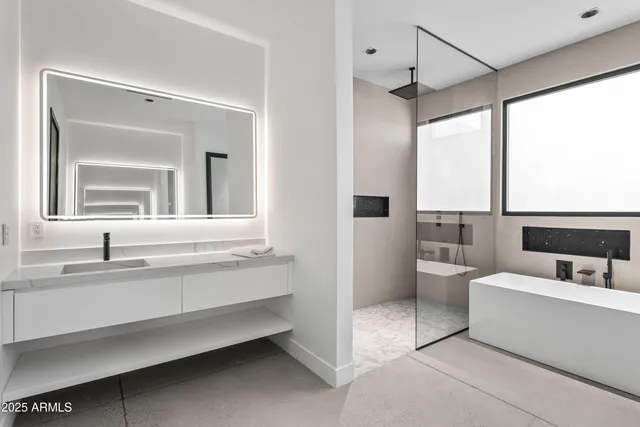 a en suite bathroom with a sink and a mirror
