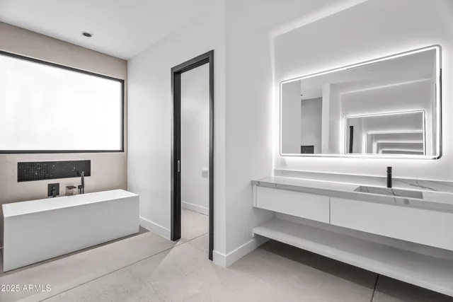 a living room with lots of furniture and a rug