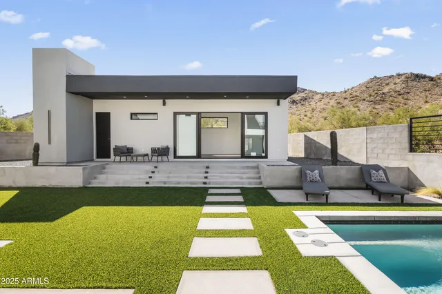 aerial view of a house with a yard