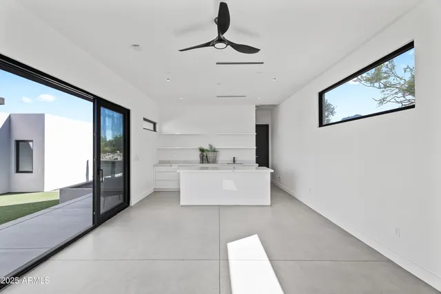 a view of a living room and a balcony