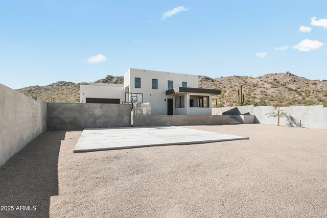 a view of a livingroom with furniture and an empty room