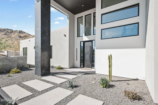 a living room with furniture large window and flat screen tv