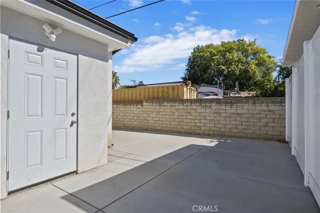 a open kitchen with kitchen island a sink stainless steel appliances and cabinets