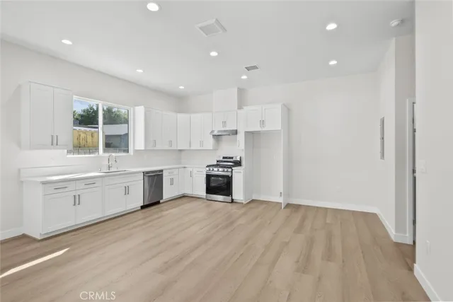 a view of a kitchen with microwave and stove