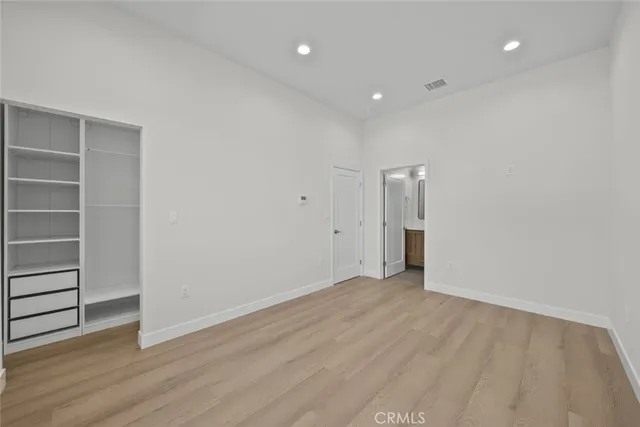 a view of room with wooden floor and window