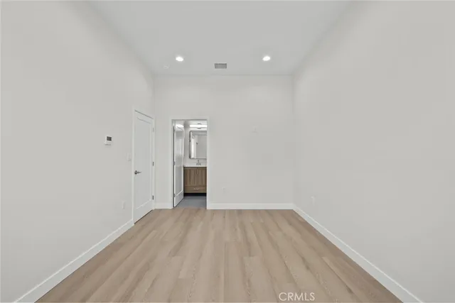 a bathroom with a granite countertop toilet sink and a mirror