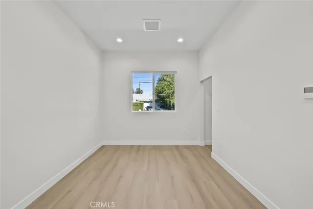 a bathroom with a toilet a sink a vanity and mirror