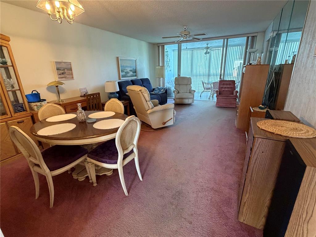 4570 Pinebrook Circle, Unit 204 Bradenton, FL 34209 - Photo 4 of 12 a dining room with furniture and window