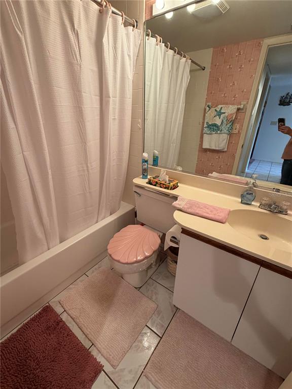 4570 Pinebrook Circle, Unit 204 Bradenton, FL 34209 - Photo 9 of 12 a bathroom with a granite countertop sink and a mirror