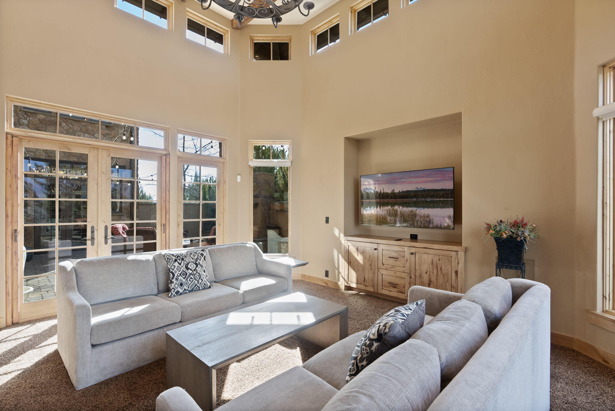 22887 Ghost Tree Lane Bend, OR 97701 - Photo 23 of 97 The light and airy dining area enjoys a beautiful double-sided natural stone fireplace creating a magical setting.