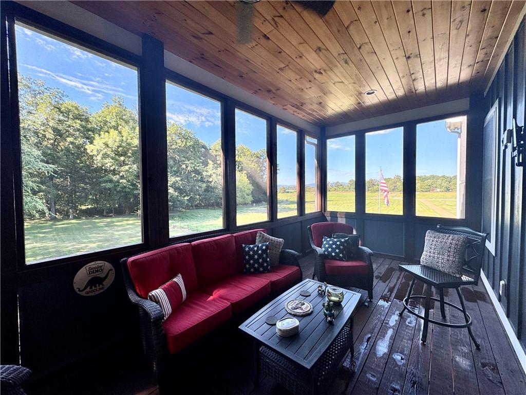 250 Hook Road Northeast Ranger, GA 30734 - Photo 17 of 114 a living room with furniture and a floor to ceiling window