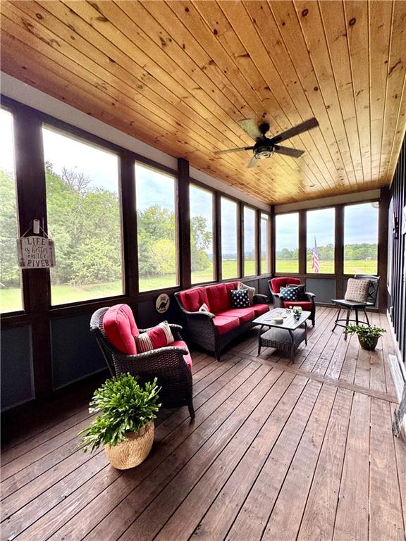 250 Hook Road Northeast Ranger, GA 30734 - Photo 27 of 114 a living room with furniture floor to ceiling window and wooden floor