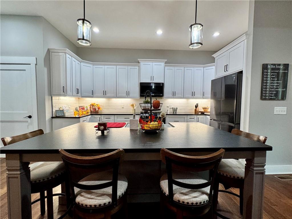 250 Hook Road Northeast Ranger, GA 30734 - Photo 35 of 114 a kitchen with a dining table and chairs