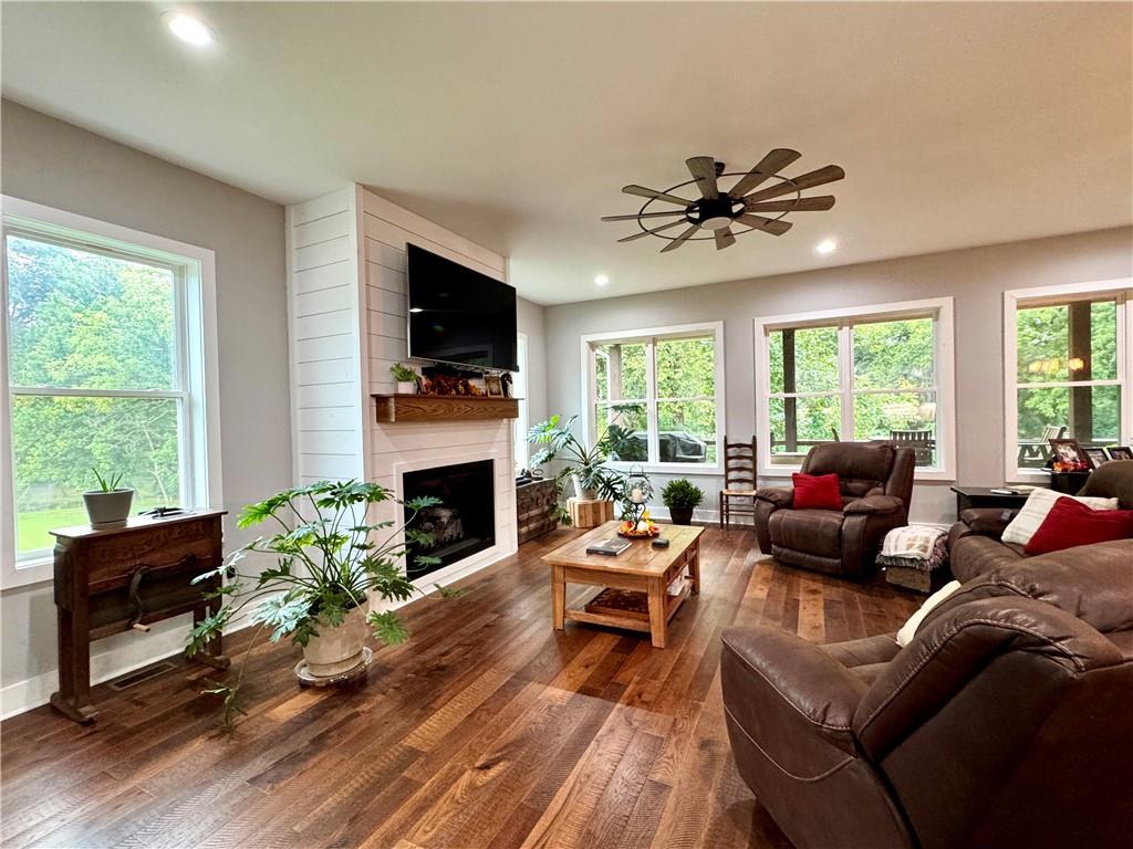 250 Hook Road Northeast Ranger, GA 30734 - Photo 44 of 114 a living room with furniture a fireplace and a flat screen tv