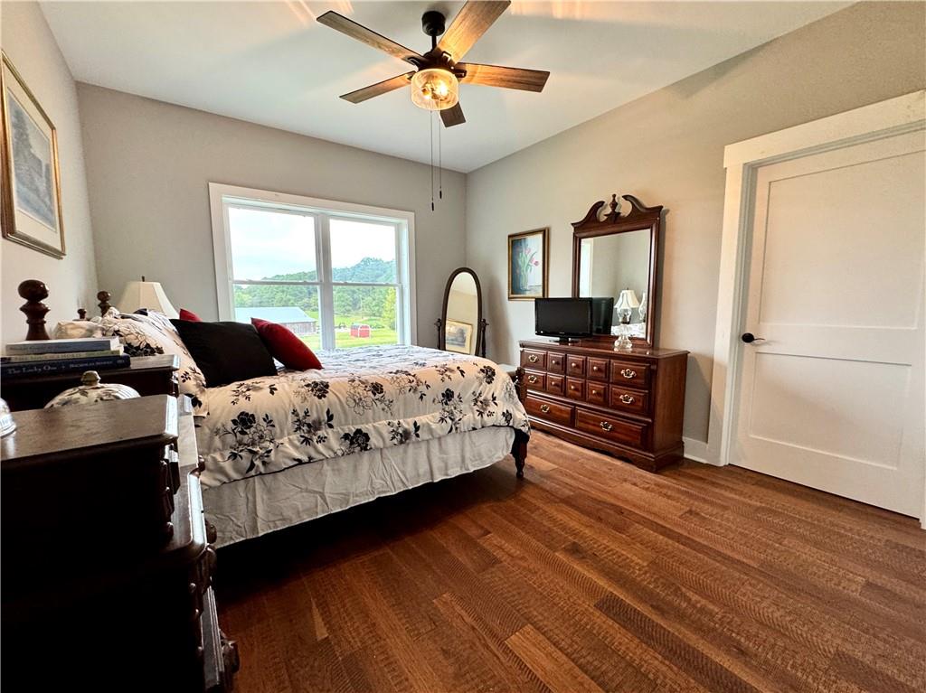 250 Hook Road Northeast Ranger, GA 30734 - Photo 63 of 114 a bedroom with a bed a couch and a window