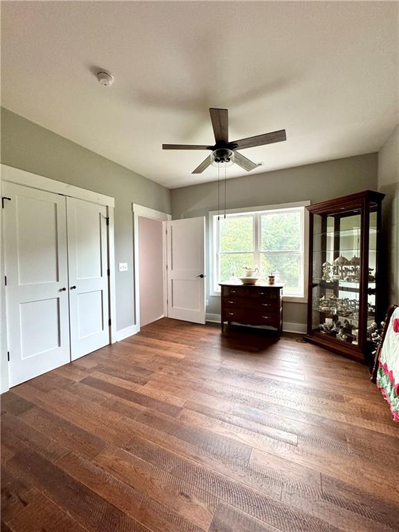 250 Hook Road Northeast Ranger, GA 30734 - Photo 64 of 114 a spacious bedroom with a bed and glass door