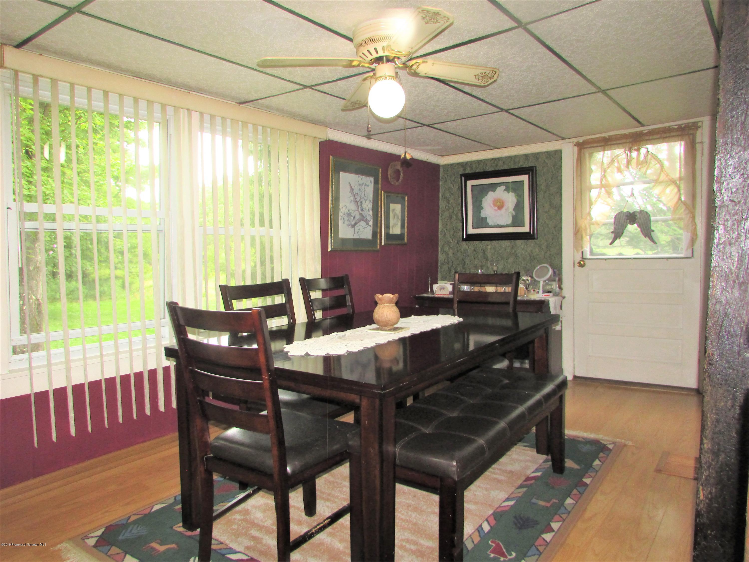 859 Flanagan Road Wyalusing, PA 18853 - Photo 4 of 19 a view of a dining room with furniture window and outside view