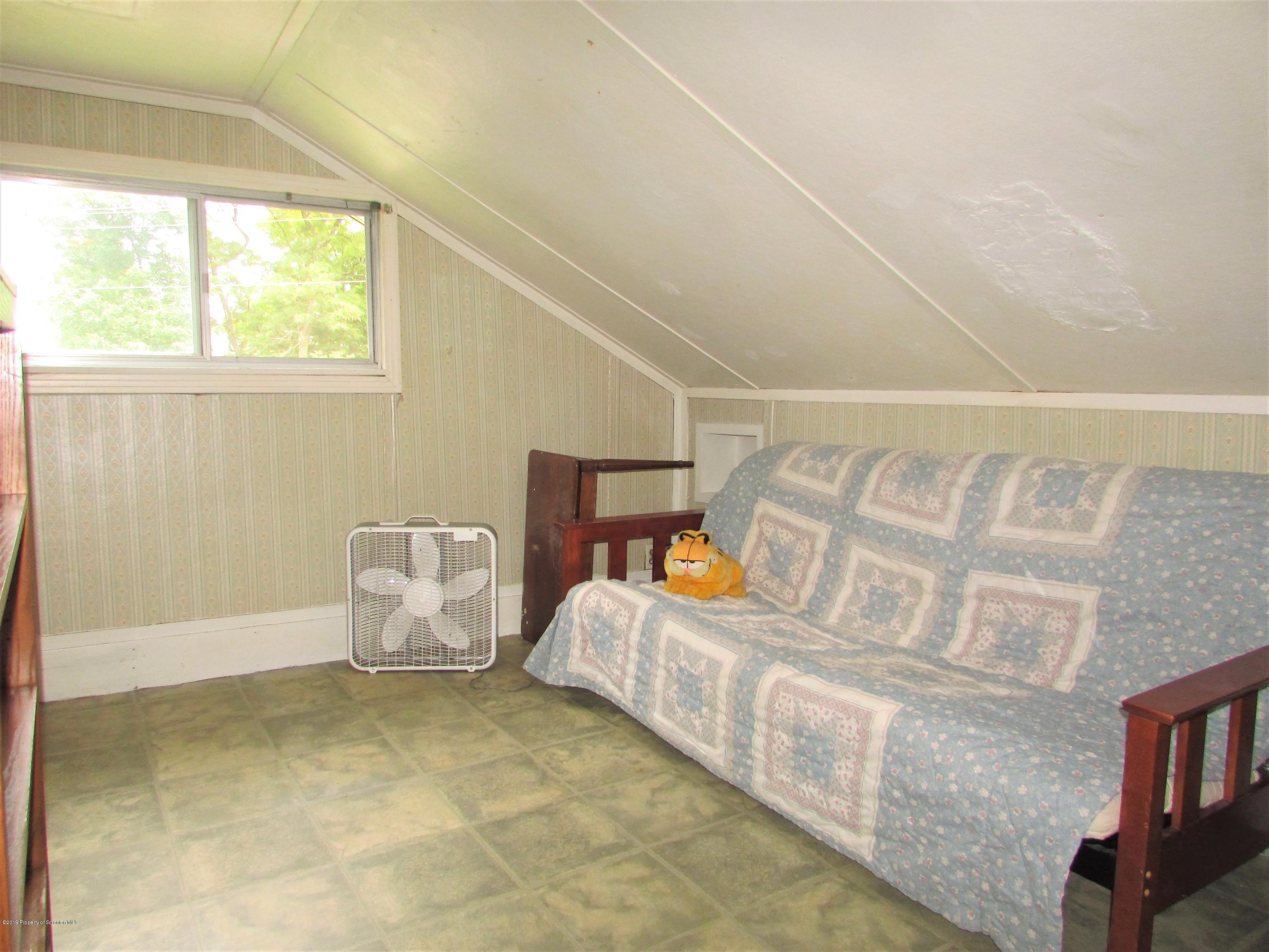 859 Flanagan Road Wyalusing, PA 18853 - Photo 10 of 19 a living room with furniture and a window