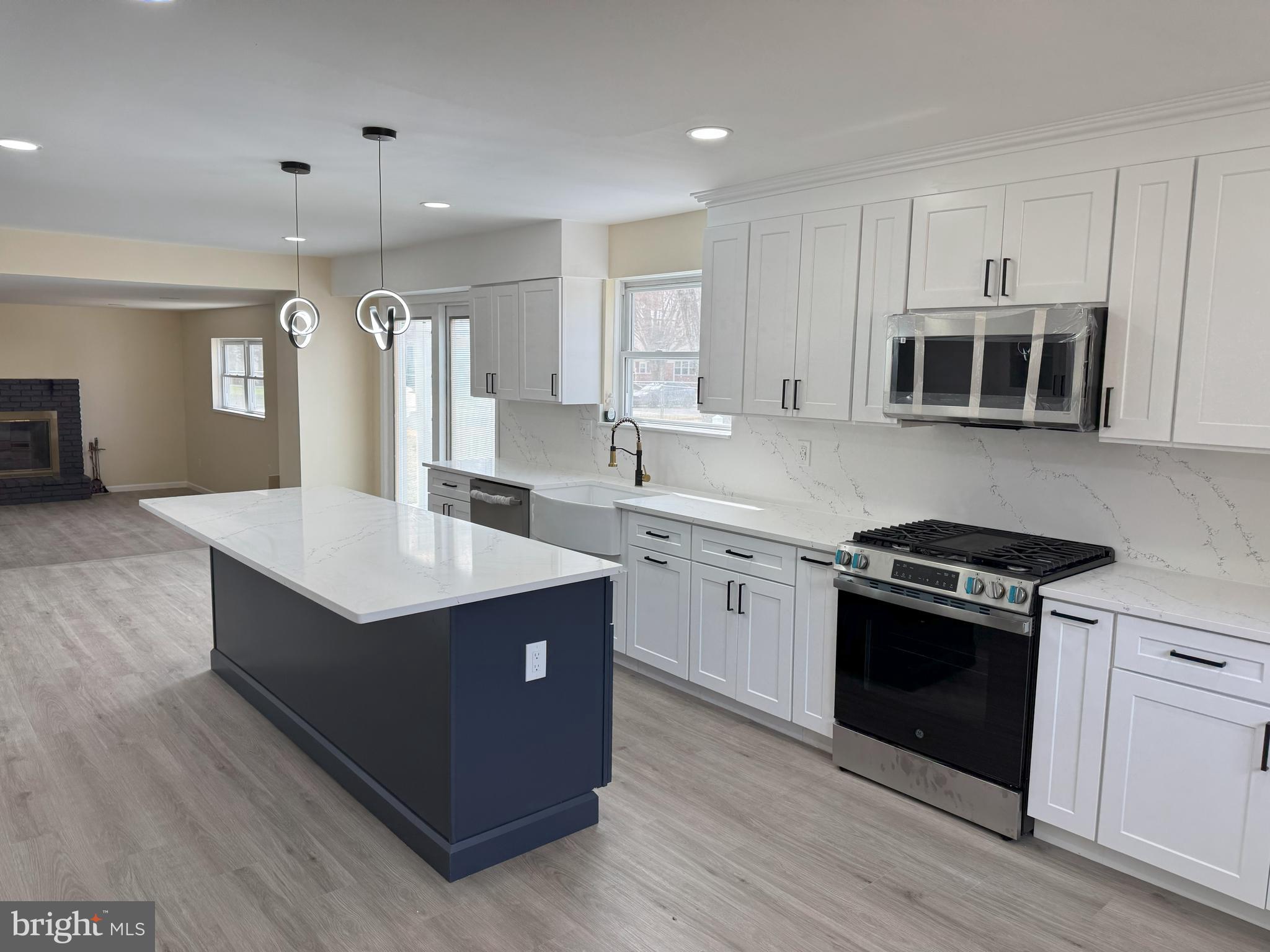 906 Marlowe Road Cherry Hill, NJ 08003 - Photo 14 of 38 a kitchen with kitchen island stainless steel appliances a stove sink and microwave