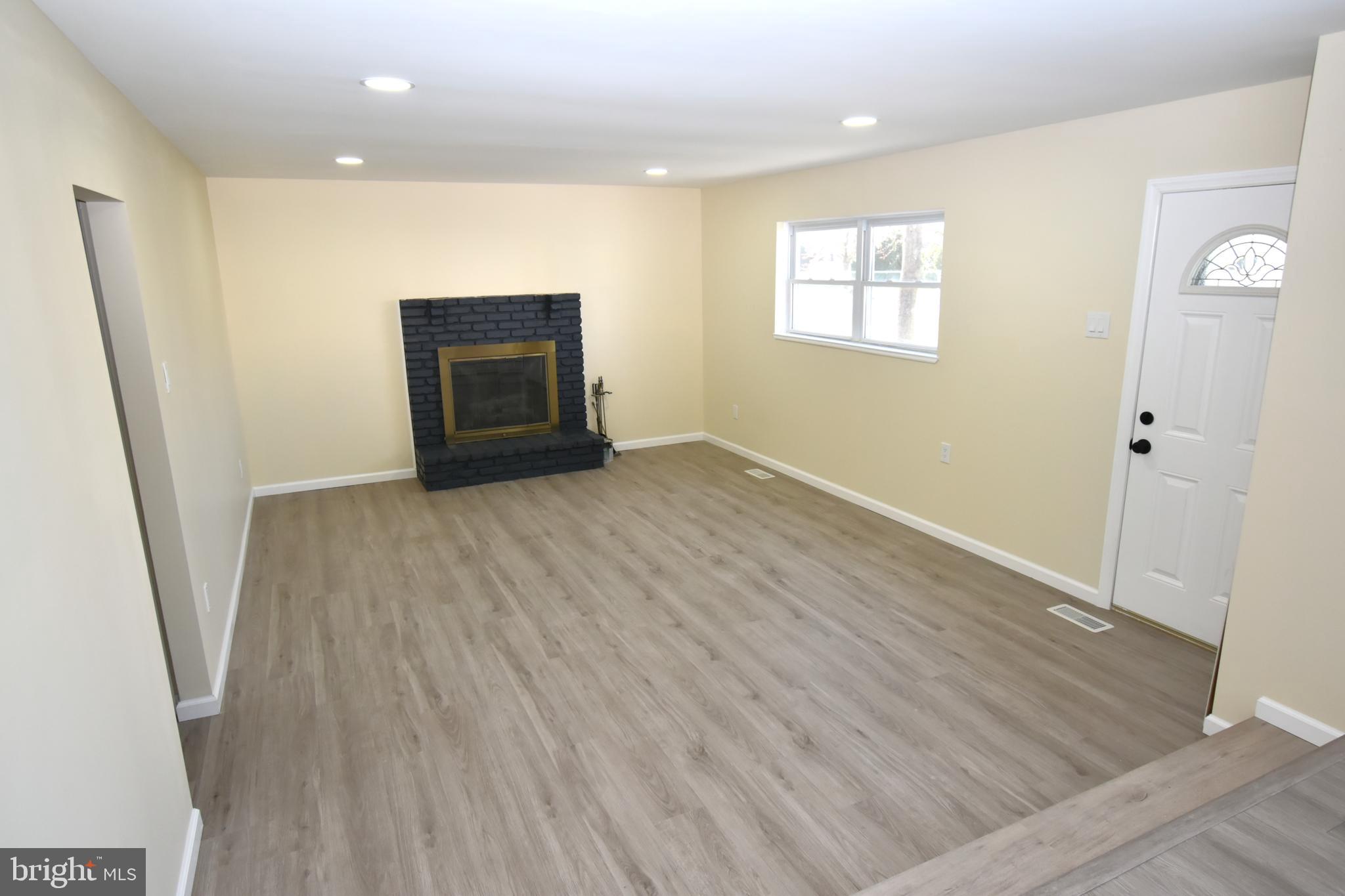 906 Marlowe Road Cherry Hill, NJ 08003 - Photo 16 of 38 an empty room with wooden floor and windows
