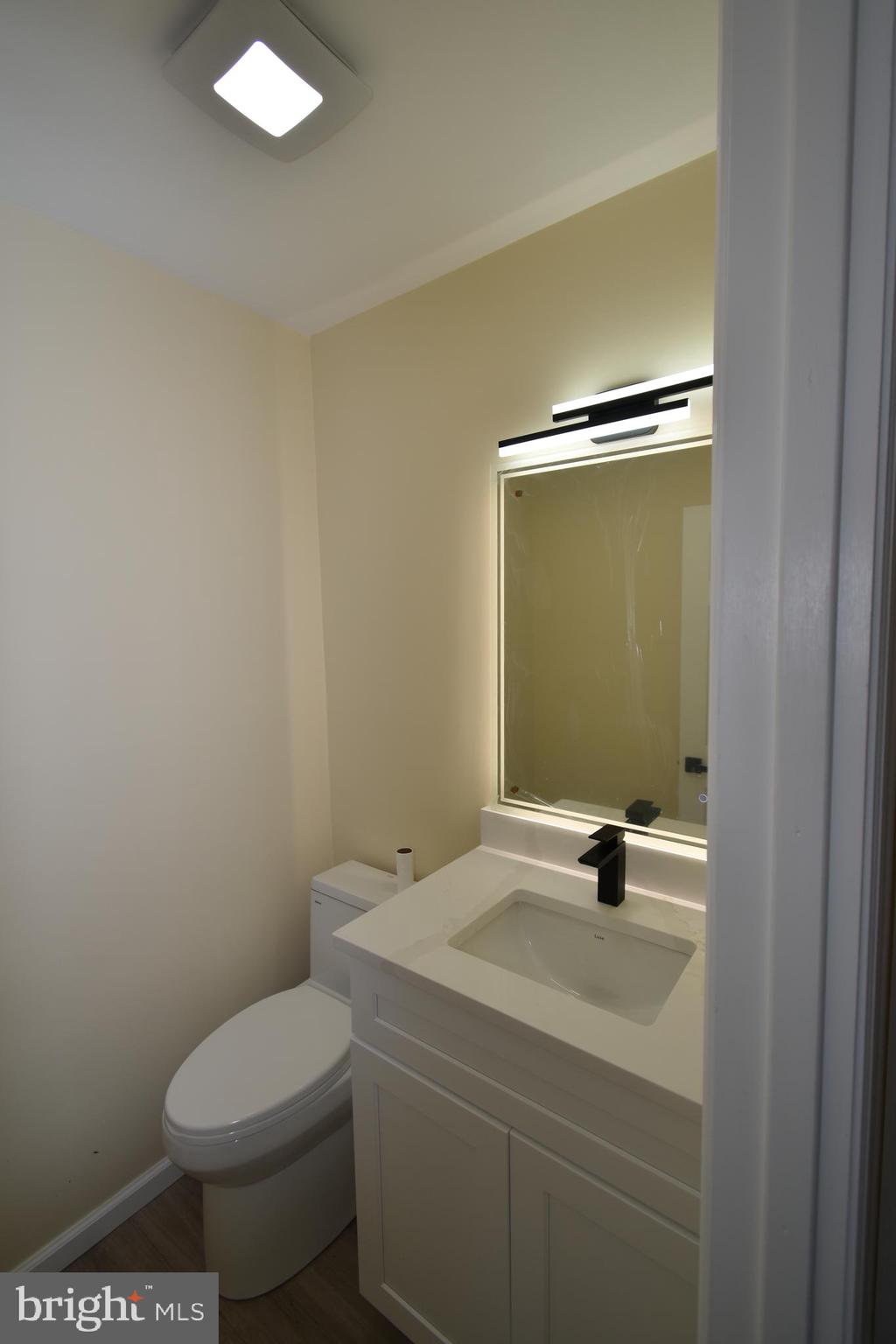 906 Marlowe Road Cherry Hill, NJ 08003 - Photo 18 of 38 a bathroom with a sink a toilet and a mirror