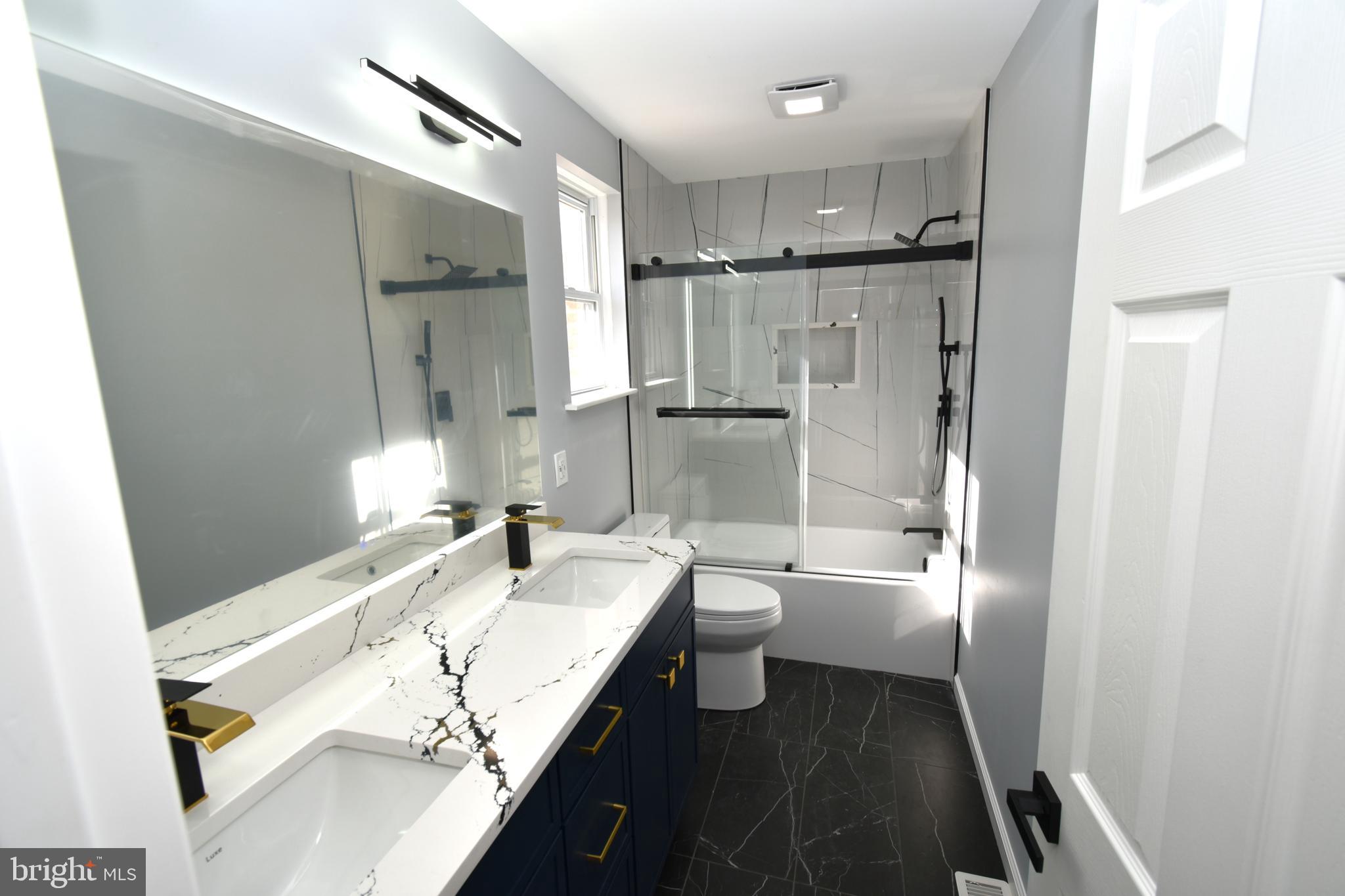 906 Marlowe Road Cherry Hill, NJ 08003 - Photo 19 of 38 a bathroom with a sink a toilet and shower