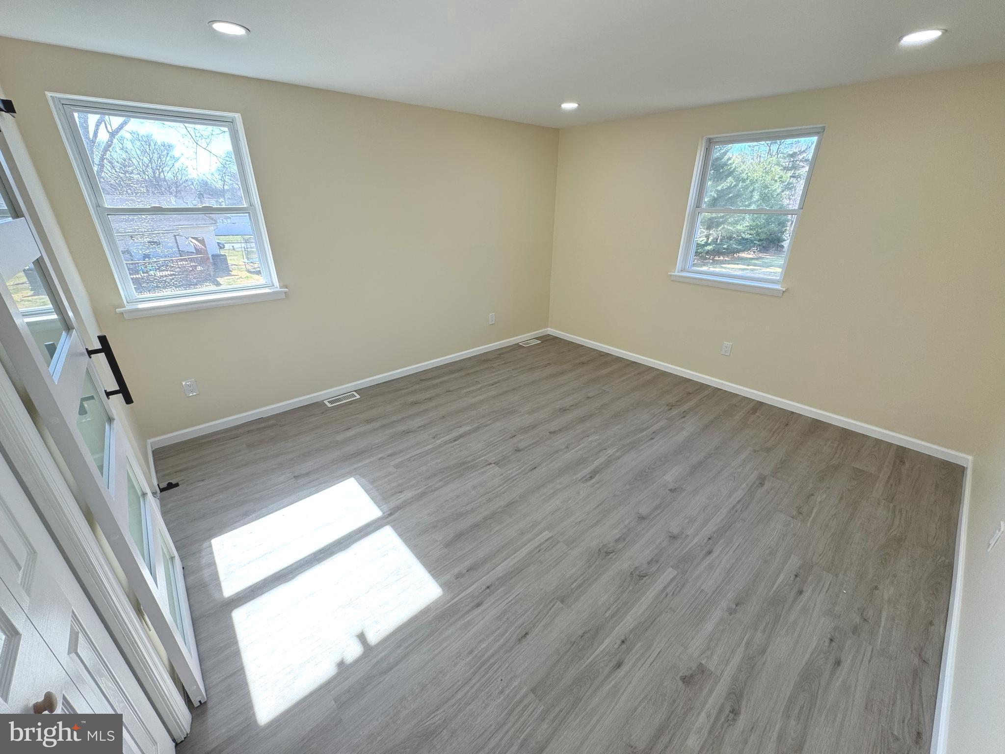 906 Marlowe Road Cherry Hill, NJ 08003 - Photo 21 of 38 a view of an empty room with wooden floor and a window